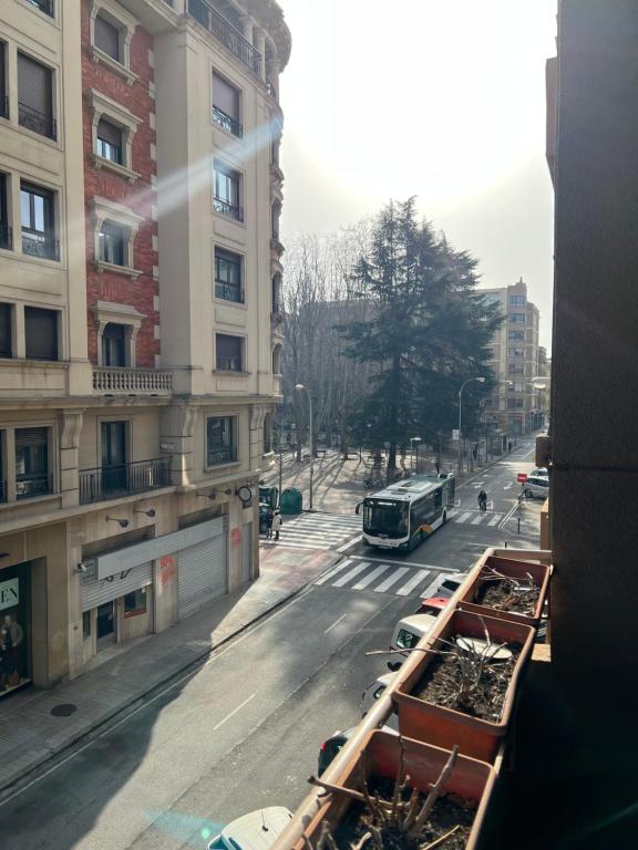 a view of a city street with cars and a bus at Apartamento Céntrico Pamplona San Fermin in Pamplona