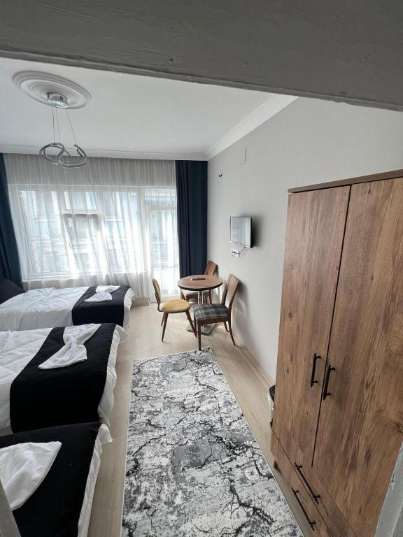 Postel nebo postele na pokoji v ubytování Taksim Millennium Suit Hotel