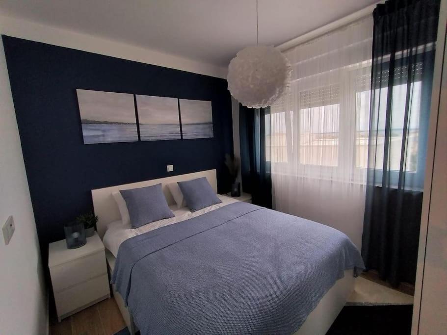 Postel nebo postele na pokoji v ubytování Apartman Eva