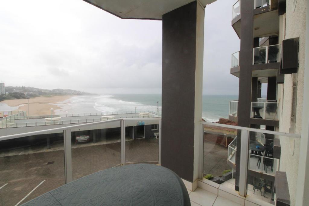 a view of the beach from a balcony of a building at Seagull 303 in Margate