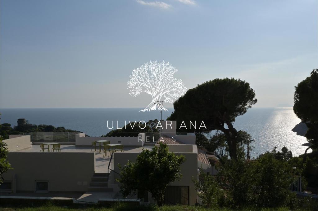 a view of a building with the ocean in the background at Relais Ulivo Ariana in Gaeta