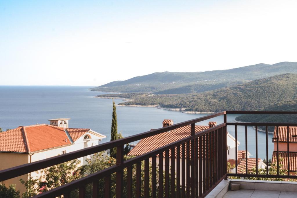 a view of the ocean from a balcony at Apartment Nia in Rabac