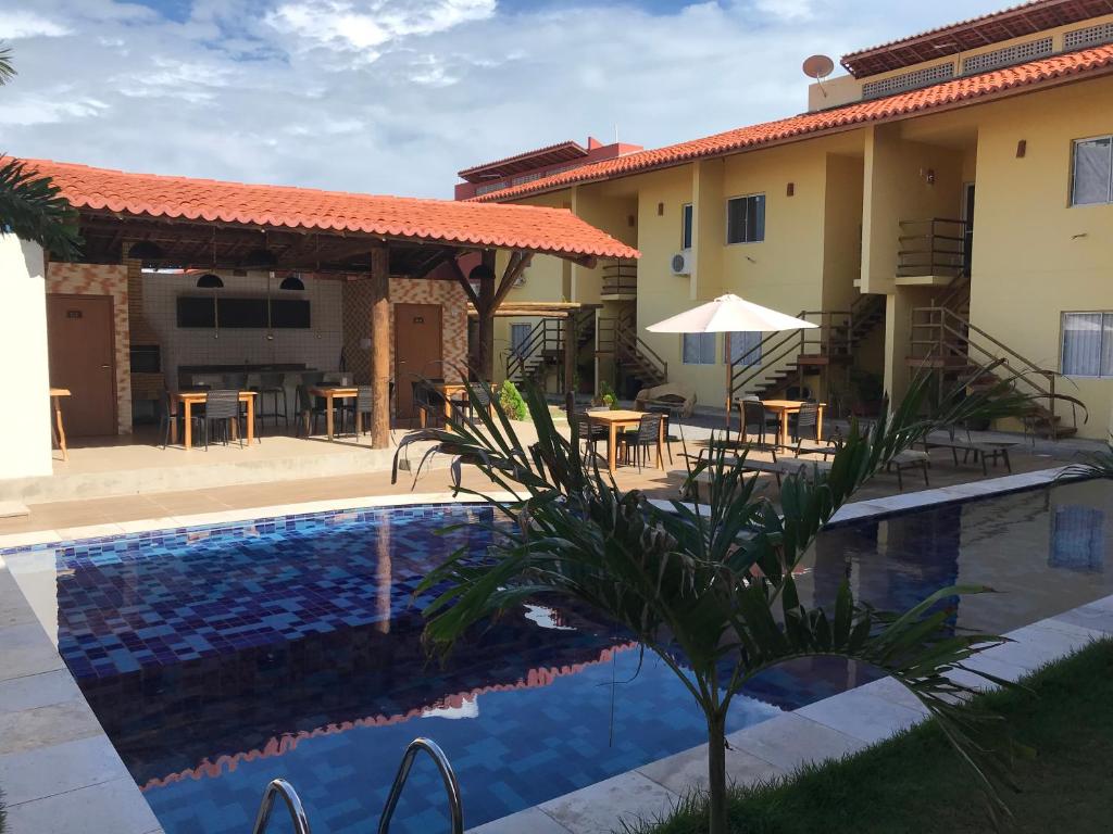 Villa con piscina e patio di Excelente apartamento Villamares a Luis Correia
