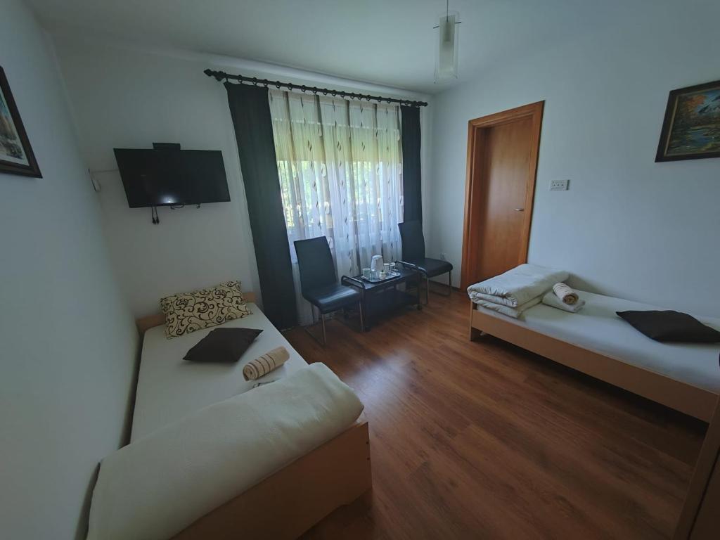 Posteľ alebo postele v izbe v ubytovaní Stari mlin