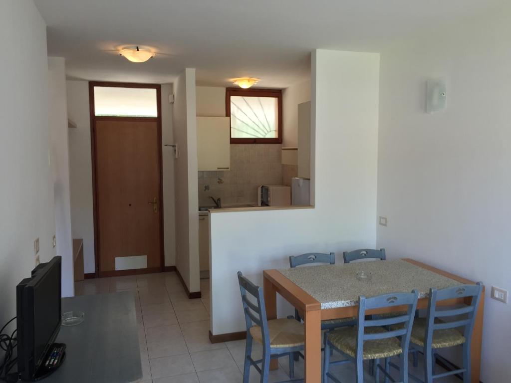 A television and/or entertainment centre at Bibione Residence Apartments