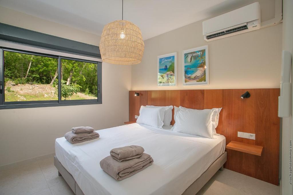 Letto o letti in una camera di Villa Mahogany