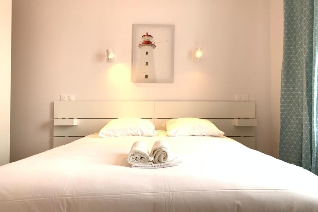 Katil atau katil-katil dalam bilik di Appart&#39;Village Le Creusot N2 NeufNetflix