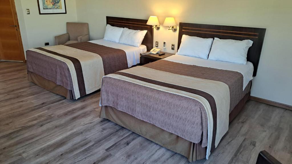 Postel nebo postele na pokoji v ubytování Hotel Diego de Almagro Valparaíso