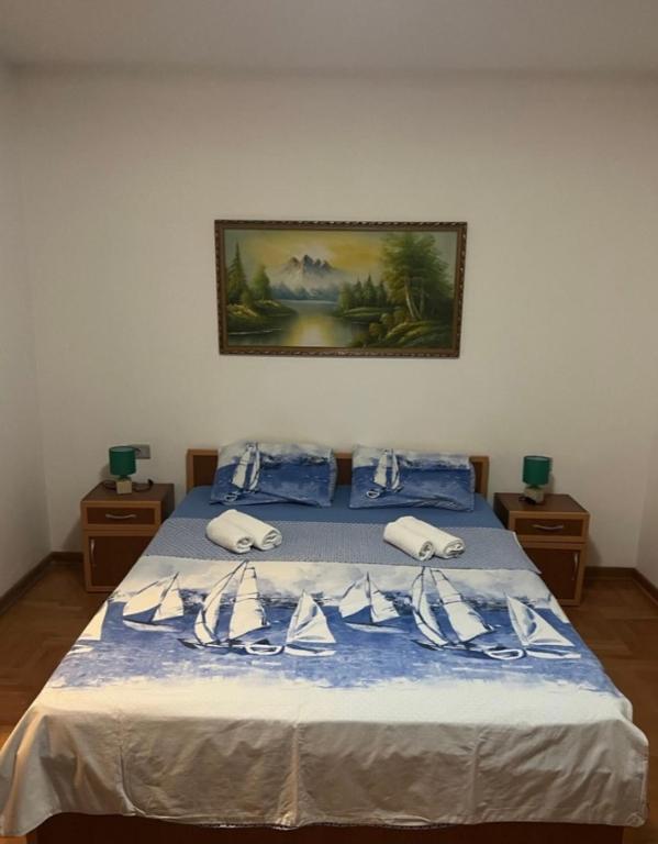 Postel nebo postele na pokoji v ubytování Apartments & Rooms Vuksanovic Ivana