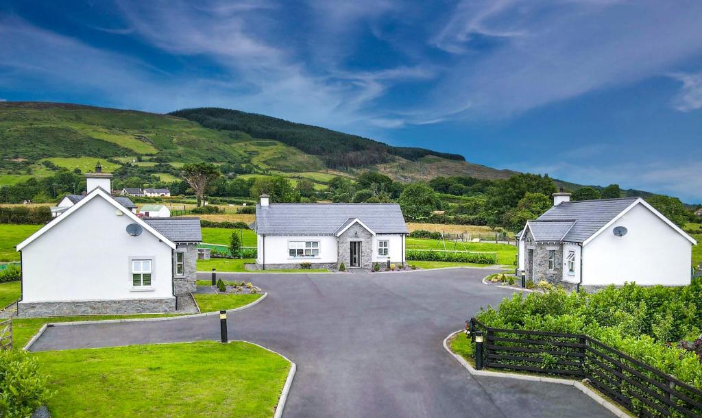 a home in the hills with a driveway at Clonlum Holiday Cottages in Newry