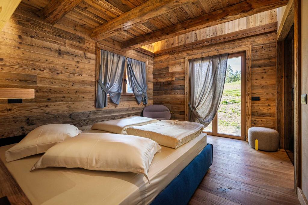 Voodi või voodid majutusasutuse Rifugio de Dòo toas
