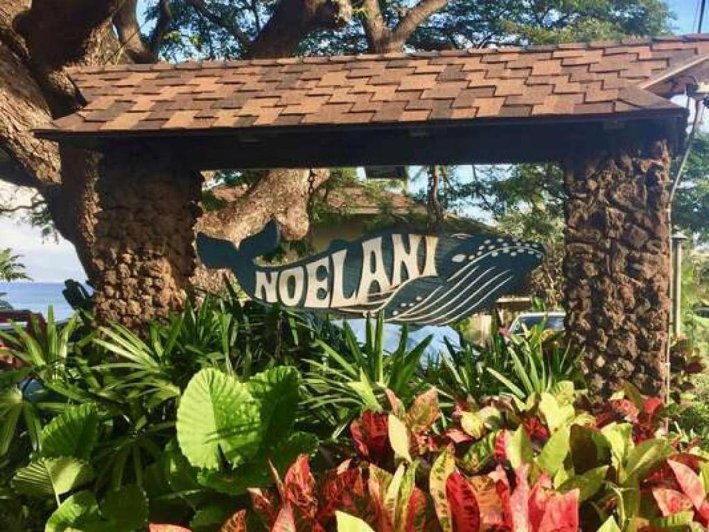a sign for a no lan in a garden at Noelani 104 in Kahana