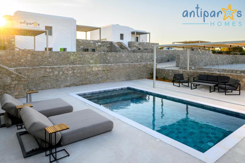 a swimming pool in the middle of a house at Antiparos Homes in Antiparos