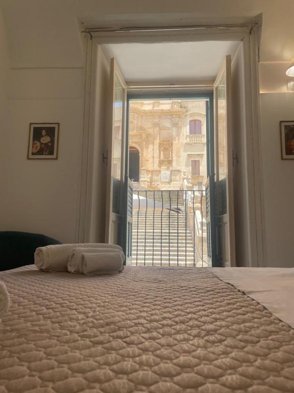 Postel nebo postele na pokoji v ubytování Immacolata Rooms