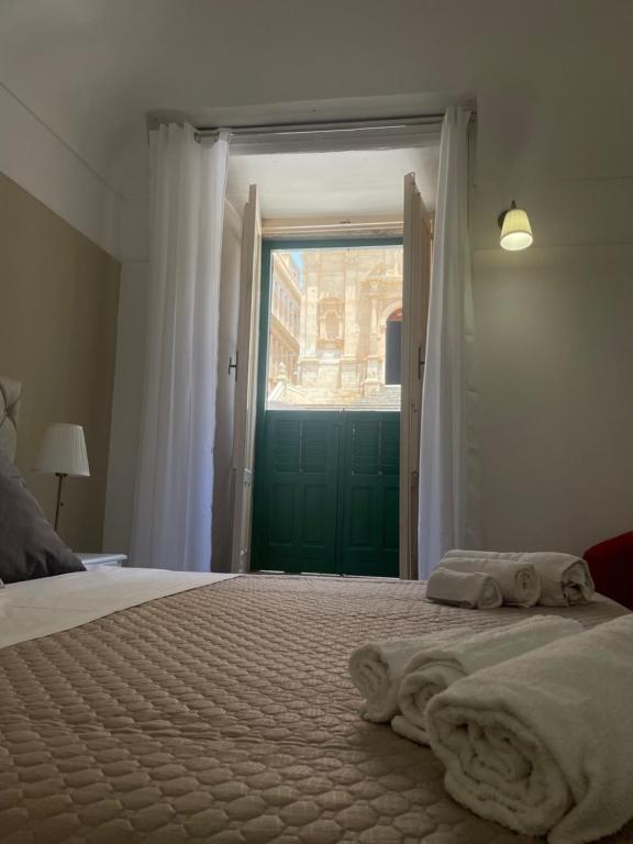 Postel nebo postele na pokoji v ubytování Immacolata Rooms