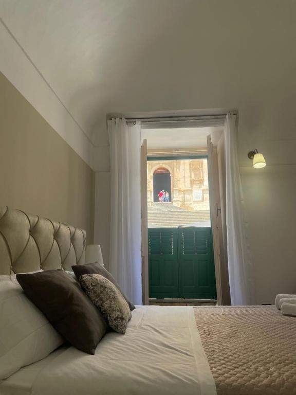 Postel nebo postele na pokoji v ubytování Immacolata Rooms