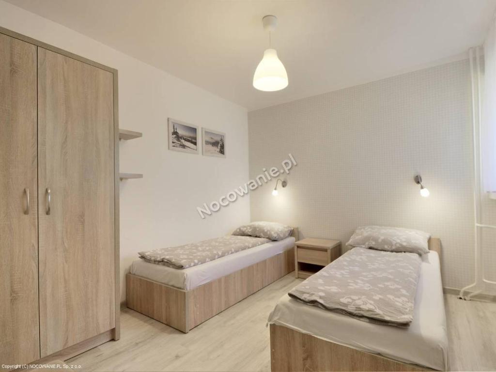 Posteľ alebo postele v izbe v ubytovaní Apartament Melisa