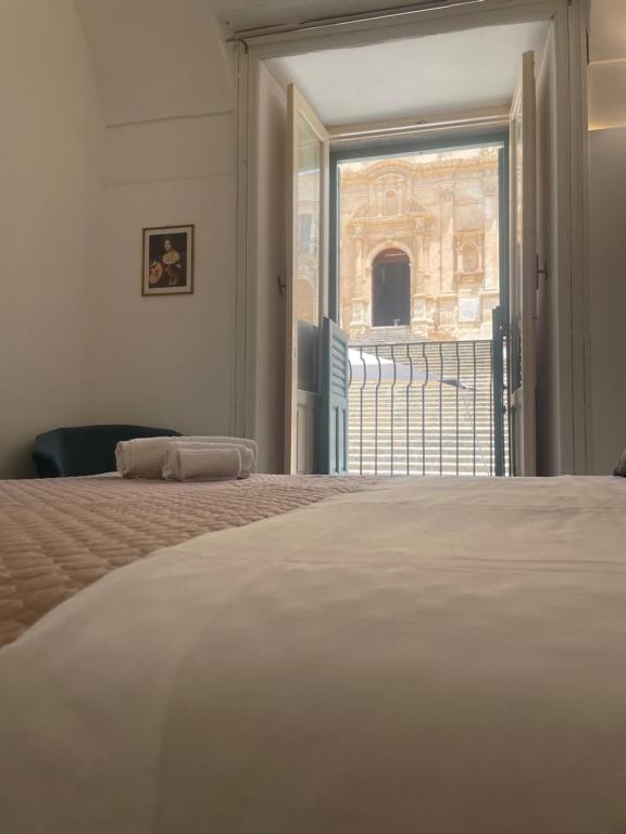 Postel nebo postele na pokoji v ubytování Immacolata Rooms