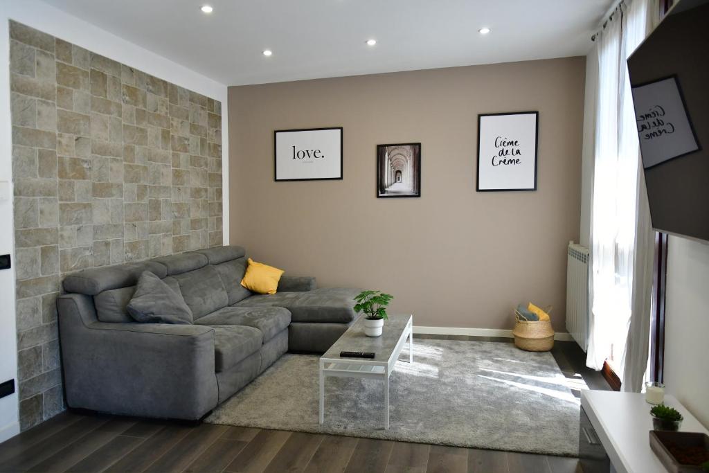 a living room with a couch and a table at New LOFT free WI-FI & free parking [Milano-Linate] in Pioltello