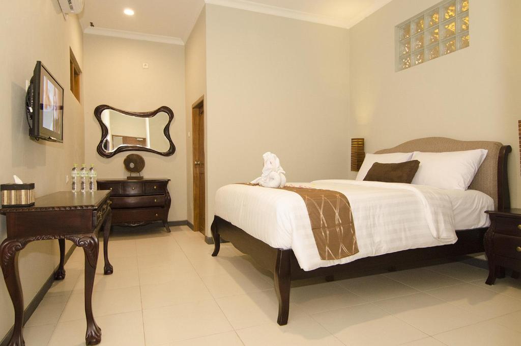 Letto o letti in una camera di Syailendra Hotel Syariah