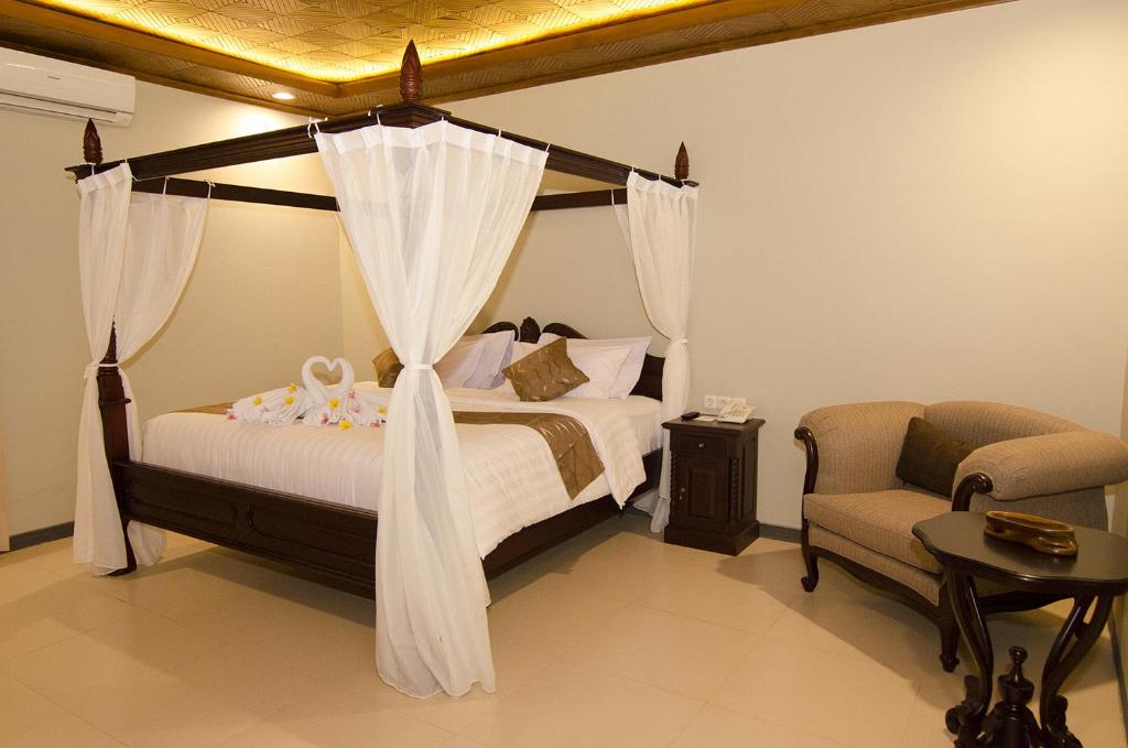 Letto o letti in una camera di Syailendra Hotel Syariah