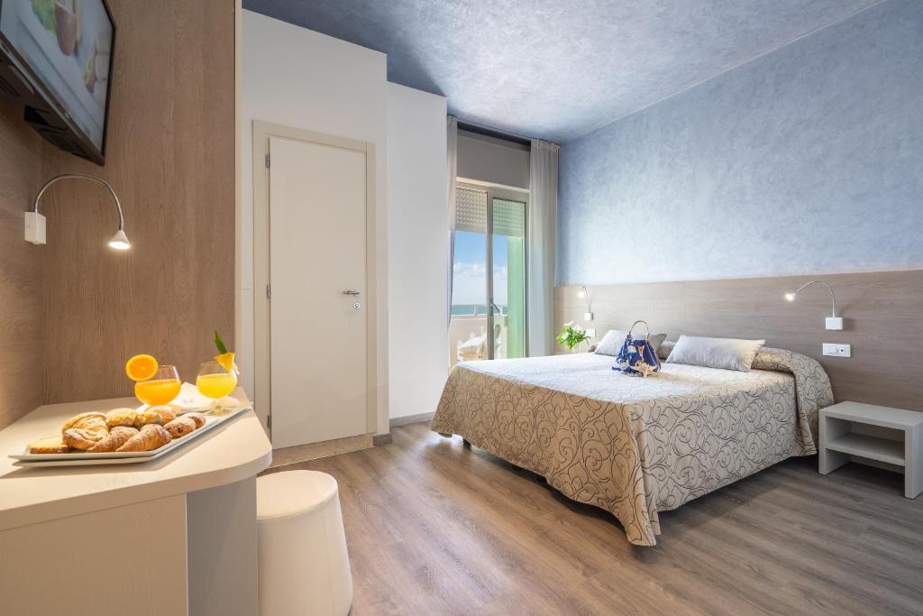 Postel nebo postele na pokoji v ubytování Hotel Montecarlo 3 Stelle Superior