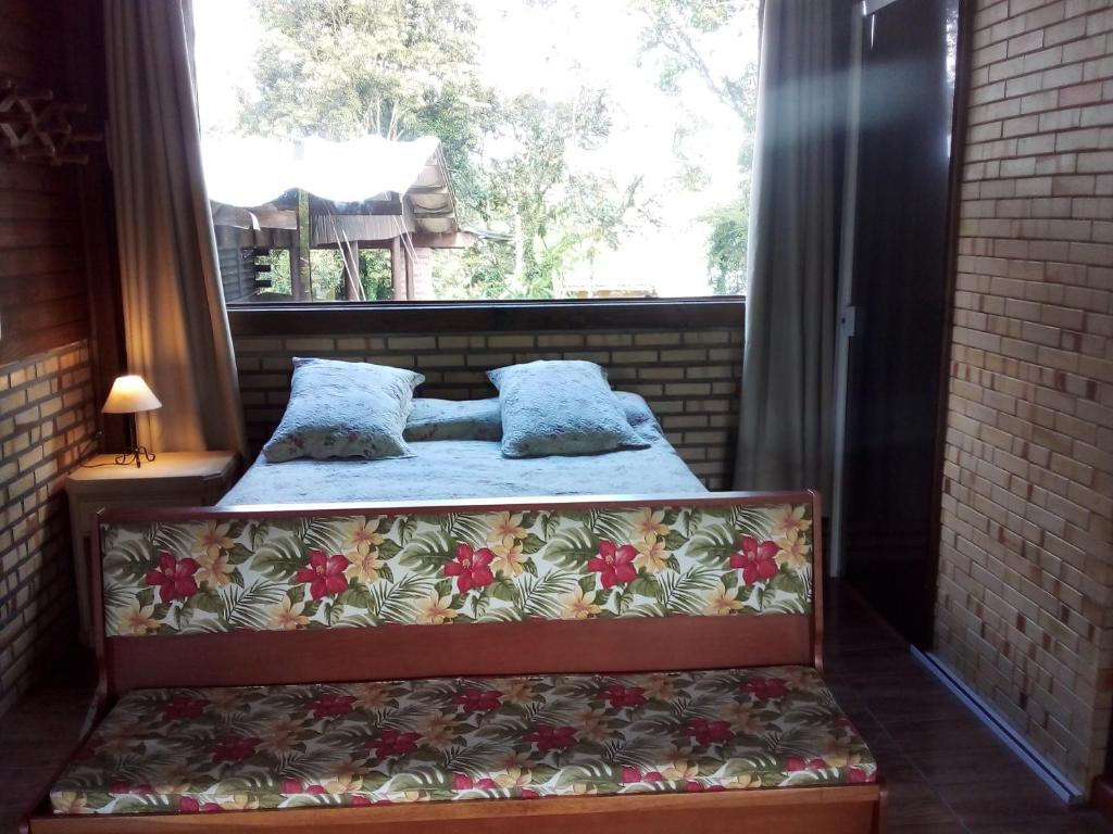 Postel nebo postele na pokoji v ubytování Alpes dos anjos casa mobiliada perto do centro canela rs