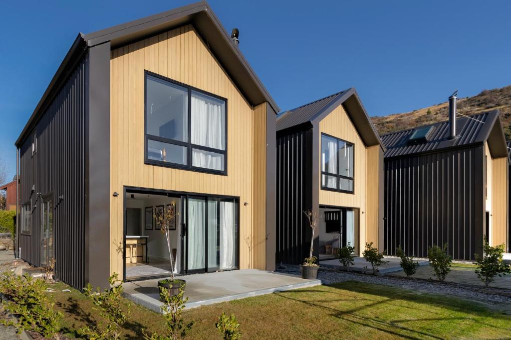 a modern house with black and yellow at Cardrona Creekside Apartment in Cardrona