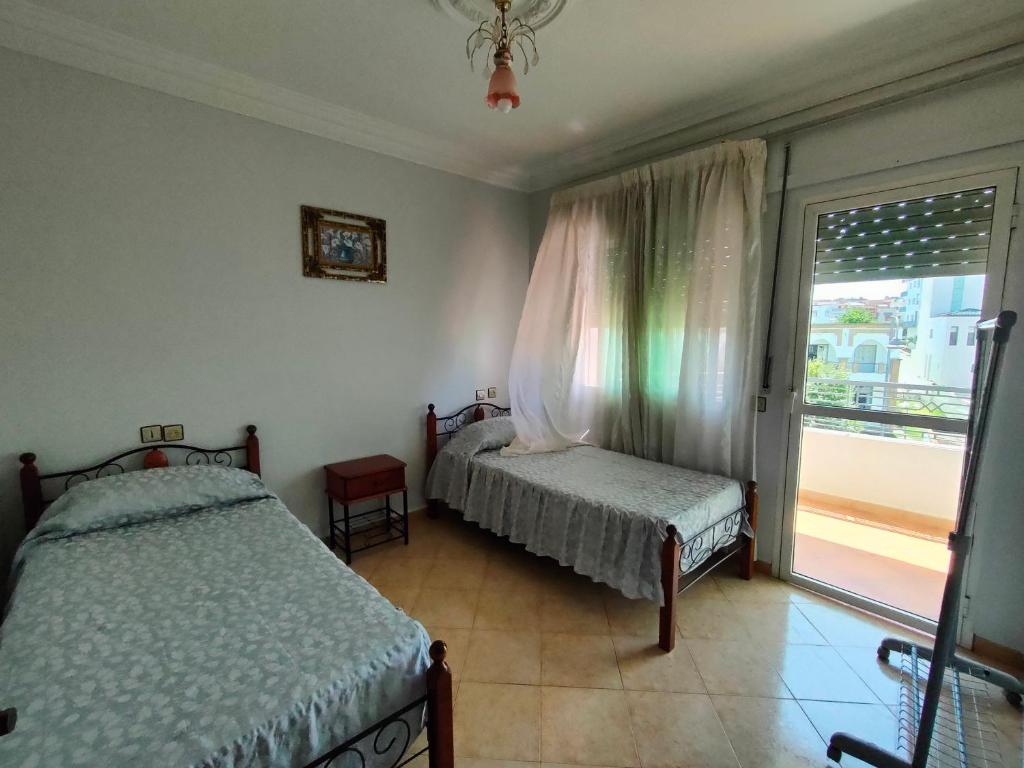 Letto o letti in una camera di La Luna Rentals