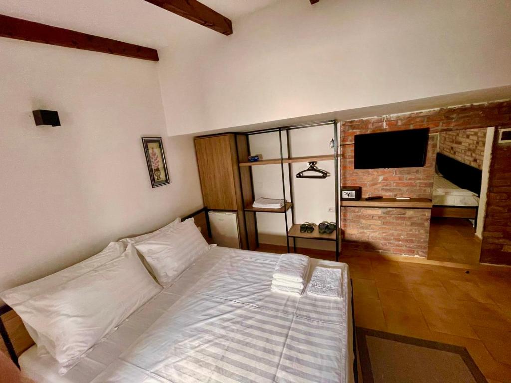 Postel nebo postele na pokoji v ubytování Hotel Kappa3 Villas