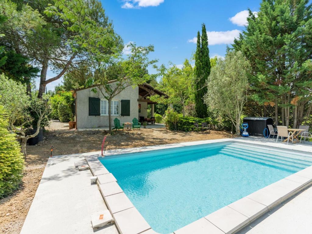a swimming pool in a yard with a house at Lovely villa in Limoux with private pool in Limoux