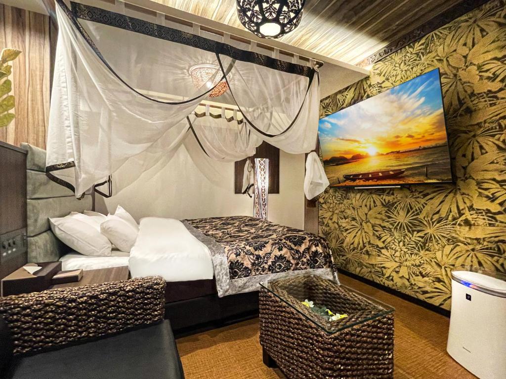 Postel nebo postele na pokoji v ubytování Hotel BaliBali ANNEX 五反田