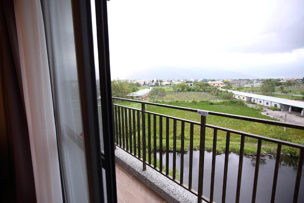 a view from a window of a balcony at 花蓮知卡宣民宿 in Ji&#39;an