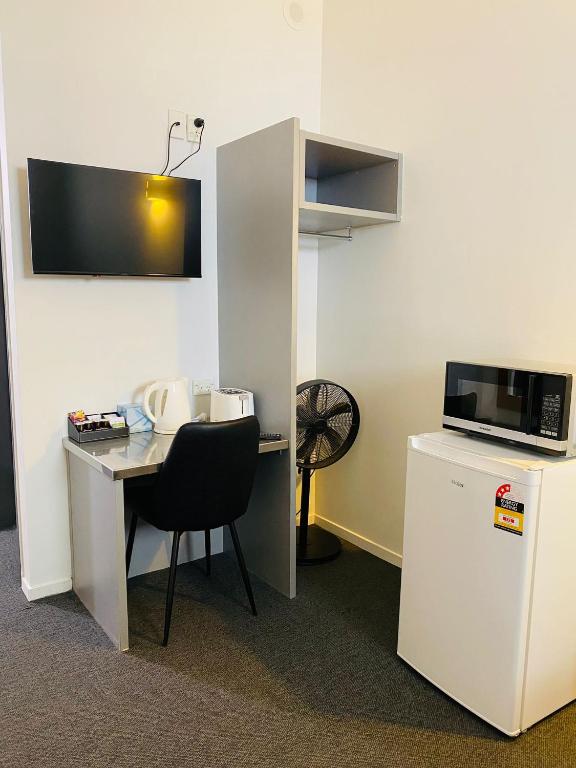 Kuchyň nebo kuchyňský kout v ubytování Gamma Hotel