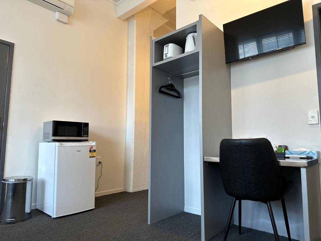 Kuchyň nebo kuchyňský kout v ubytování Gamma Hotel