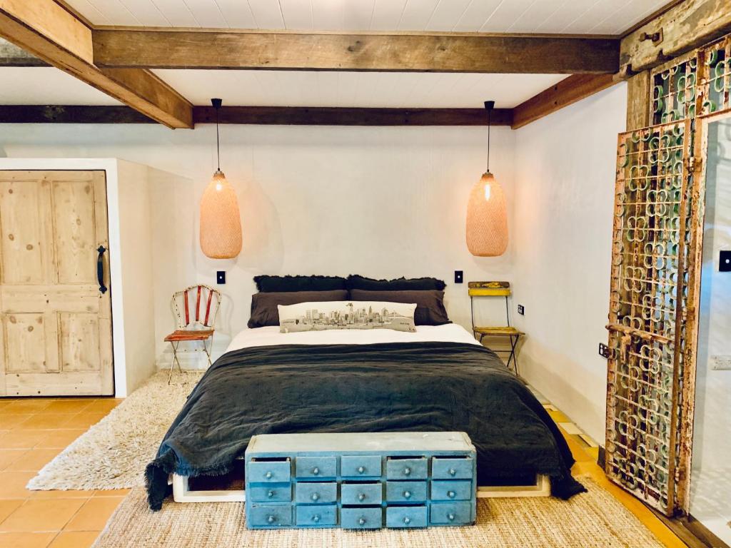 a bedroom with a large bed with blue boxes at Whitewater Byron Bay in Byron Bay