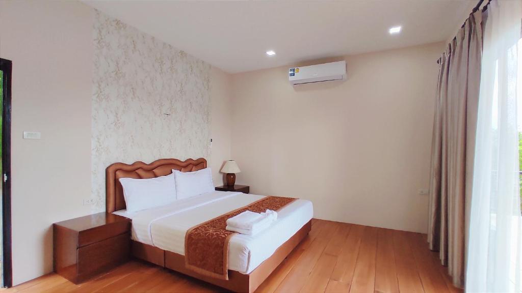 Postel nebo postele na pokoji v ubytování So View Phuket Resort