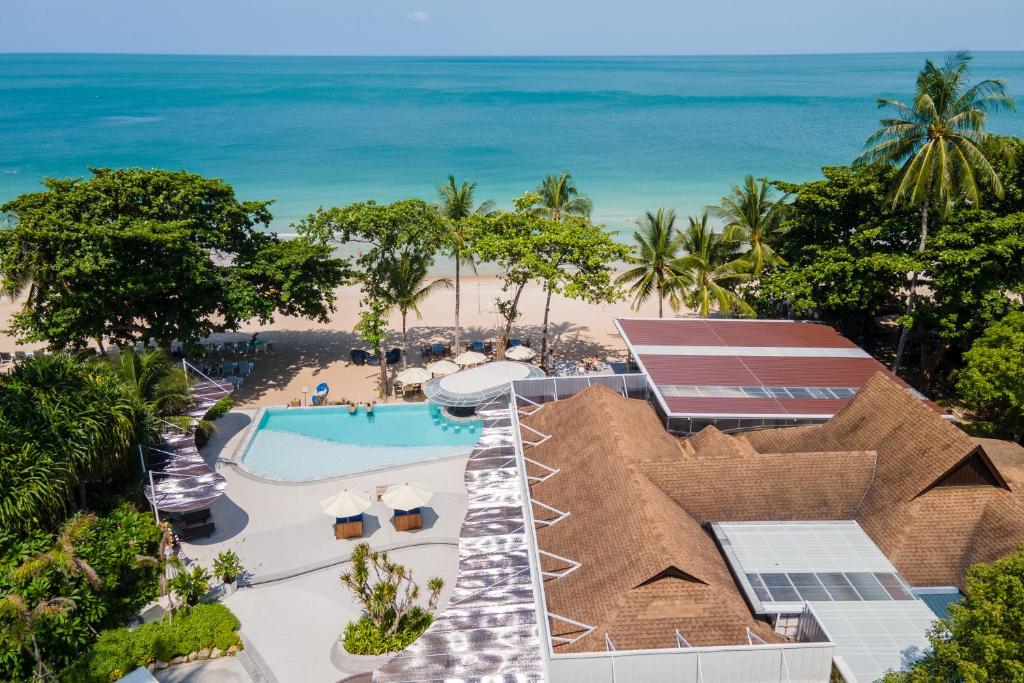 an aerial view of a resort with a swimming pool and the beach at The Fair House Beach Resort & Hotel in Chaweng Noi Beach