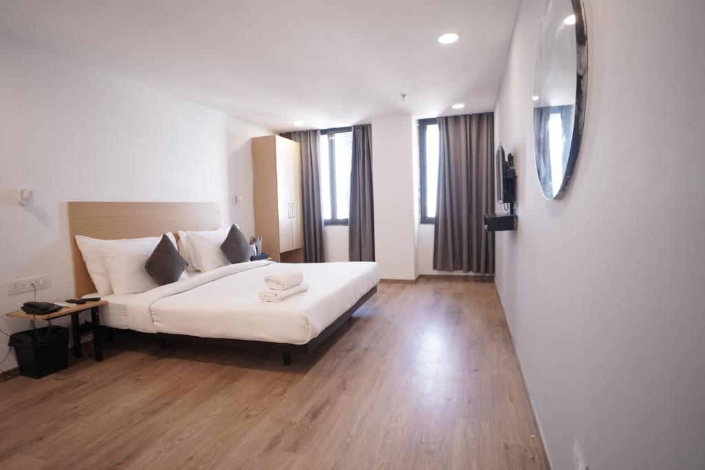 Postel nebo postele na pokoji v ubytování Hotel Sunflare