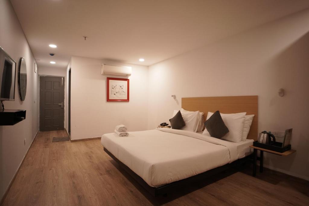 Postel nebo postele na pokoji v ubytování Hotel Sunflare