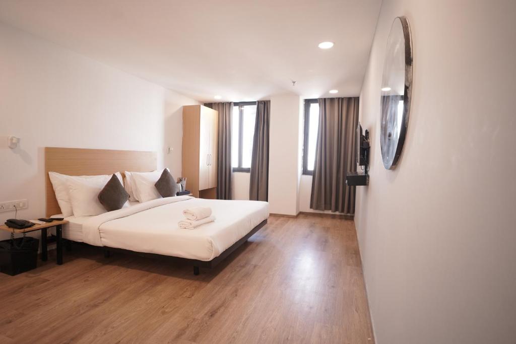 Postel nebo postele na pokoji v ubytování Hotel Sunflare