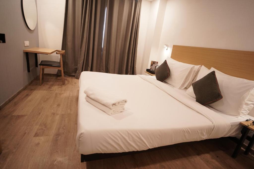 Postel nebo postele na pokoji v ubytování Hotel Sunflare