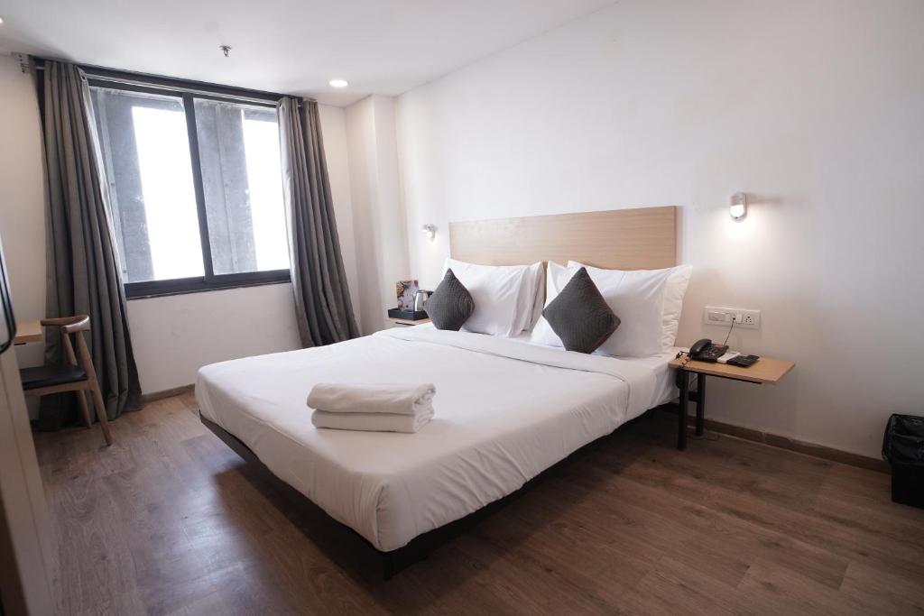 Postel nebo postele na pokoji v ubytování Hotel Sunflare