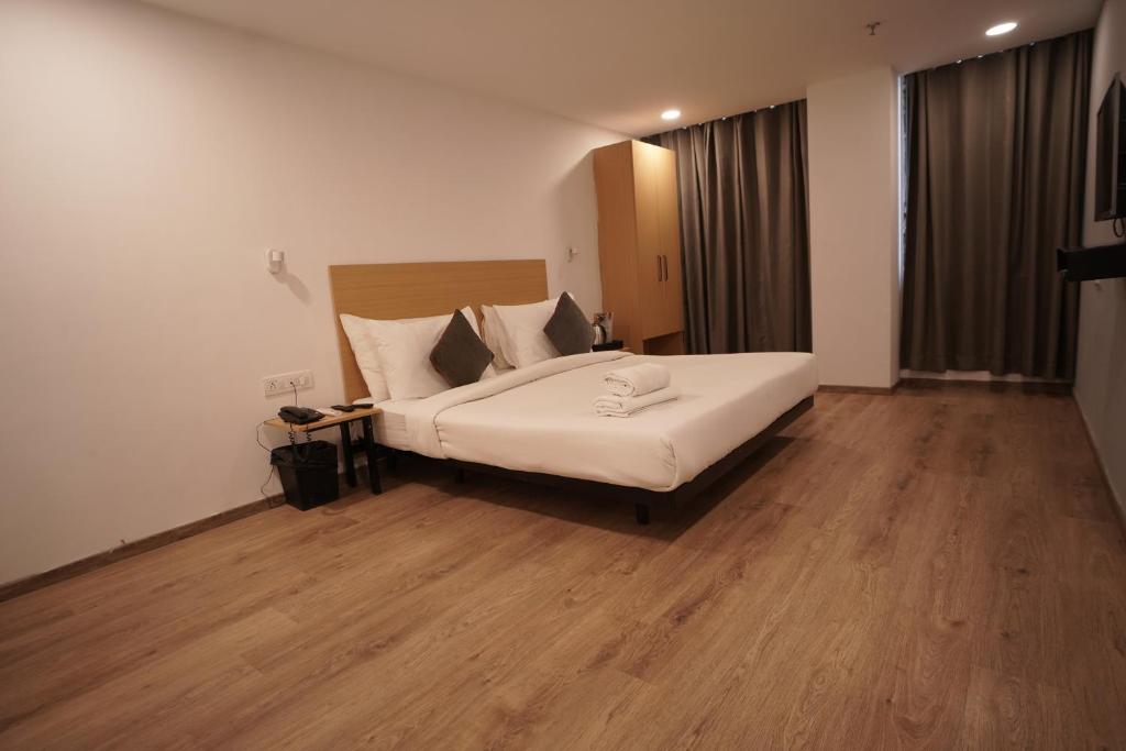 Postel nebo postele na pokoji v ubytování Hotel Sunflare