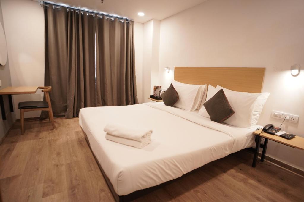 Postel nebo postele na pokoji v ubytování Hotel Sunflare
