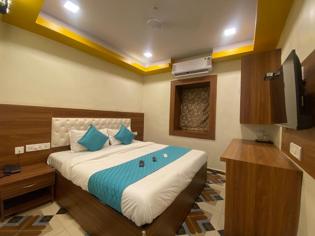 Ліжко або ліжка в номері Hotel Jodiya - Near CST