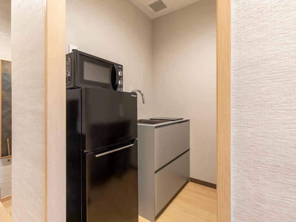 Kuchyň nebo kuchyňský kout v ubytování Tabist kiki HOTEL KYOTO Gojo Karasuma