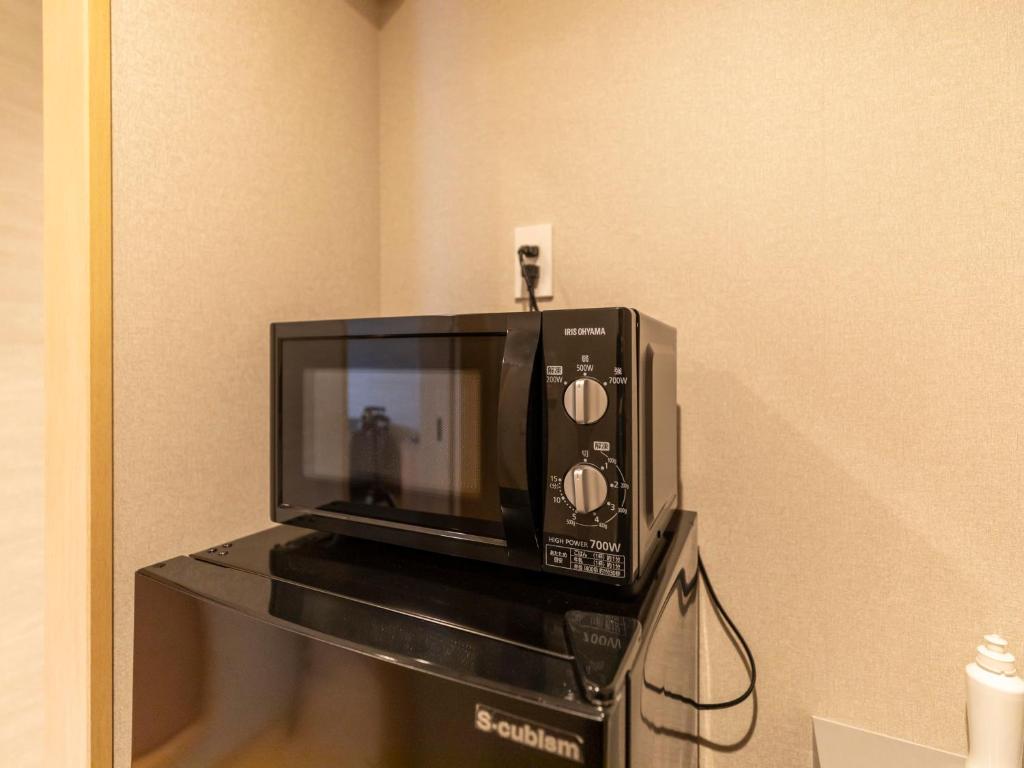 Kuchyň nebo kuchyňský kout v ubytování Tabist kiki HOTEL KYOTO Gojo Karasuma