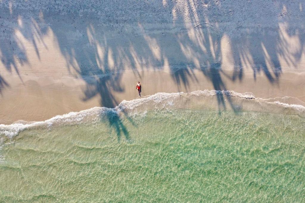 an aerial view of a person standing on the beach at Pax Ana Doc Let Resort & Spa in Ninh Hòa
