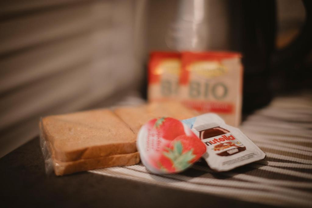 a close up of a piece of bread and fruit on a table at Villa Valentina Versilia in Viareggio